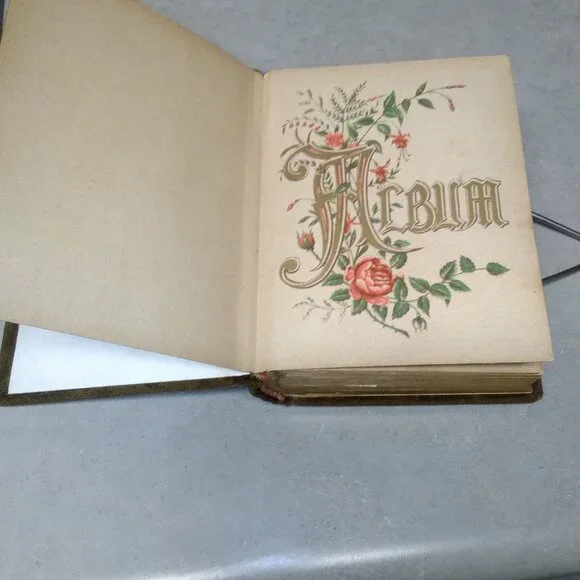 Edwardian era Photo album sweud with silver plated medallion & buckle
